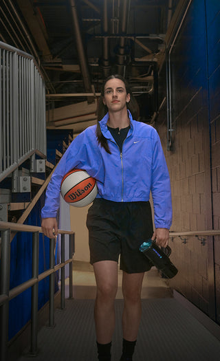 Caitlin Clark Walking Out Of Basketball Tunnel Holding Stanley Quencher Tumbler